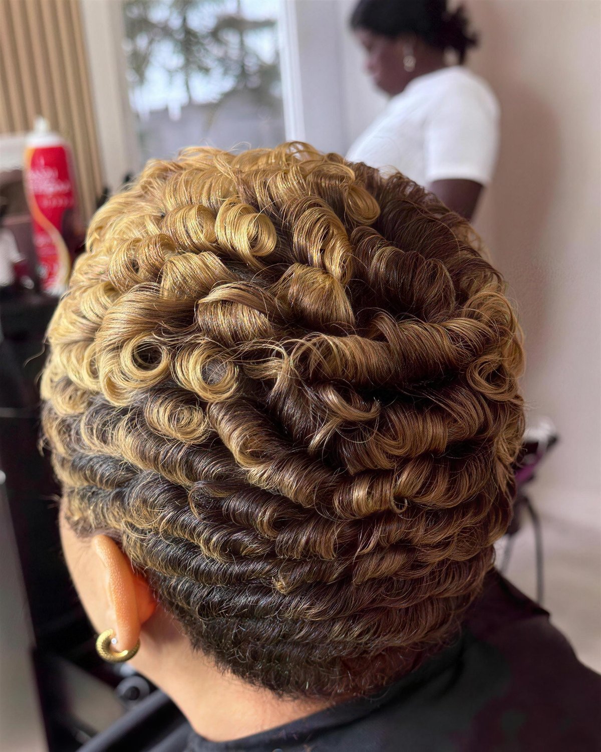 Honey-blonde pin curls, back view.